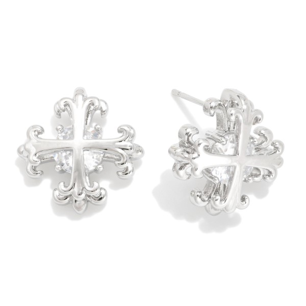 Metal Tone Plus Cross Earring Featuring Cubic Zirconia 

- Approximately 1." D 
- Gold Dipped
- Brass Base 
- Hypoallergenic