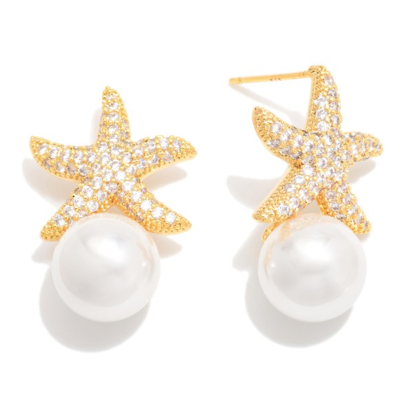 Cubic Zirconia Starfish Post Drop Earring Featuring Pearl 

- Approximately .75" D 
- Gold Dipped
- Brass Base 
- Hypoallergenic