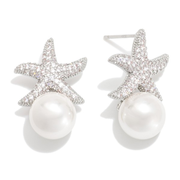 Cubic Zirconia Starfish Post Drop Earring Featuring Pearl 

- Approximately .75" D 
- Gold Dipped
- Brass Base 
- Hypoallergenic