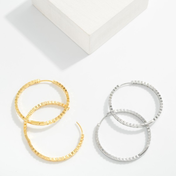 Textured Twisted Metal Tone Hoop Drop Earrings

- Approximately 1.5" D 
- 14K Gold Dipped
- Brass Base 
- Hypoallergenic