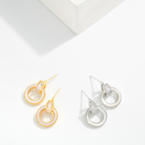 Metal Tone Pearlescent Door Knocker Drop Earrings Featuring Cubic Zirconia

- Approximately .5" D 
- Gold Dipped
- Brass Base 
- Hypoallergenic