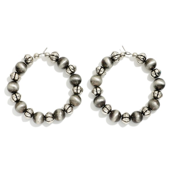 Metal Tone Beaded Hoop Drop Earrings Featuring Brushed Metal Beads 

- Approximately 1.5" D 