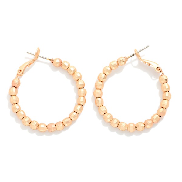 Metal Tone Beaded Huggie Hoop Drop Earring 

- Approximately 1.05" D 