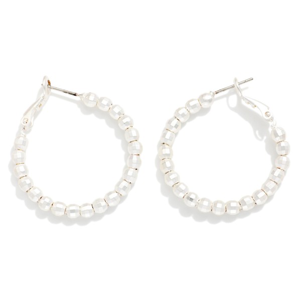 Metal Tone Beaded Huggie Hoop Drop Earring 

- Approximately 1.05" D 