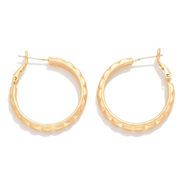 Metal Tone Geometric Shape Hoop Earrings 

- Approximately 1" D