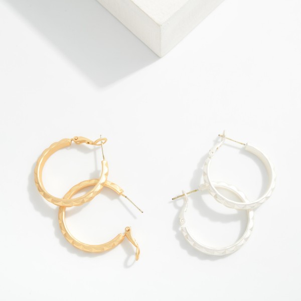Metal Tone Geometric Shape Hoop Earrings 

- Approximately 1" D