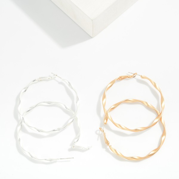 Large Twisted Metal Hoop Earrings 

- Approximately 2" D