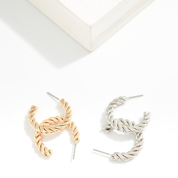 Flat Twisted Metal Hoop Earrings 

- Approximately .75" D