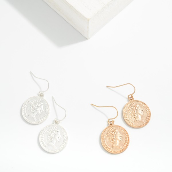 Metal Tone Coin Drop Earring

Approximately 1.05" L 

