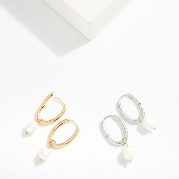 Metal Tone Oval Hoop Earrings With Pearl Dangle Detail 

- Approximately 1.5" L