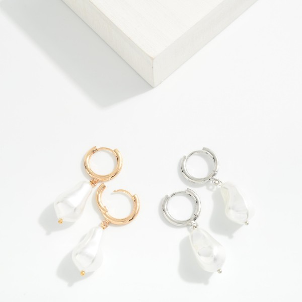 Metal Tone Huggie Hoop Drop Earring With Pearl Dangle Detail

- Approximately 2" L 