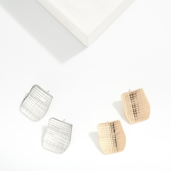 Metal Tone Rectangular Post Drop Earrings With Geometric Engraving Detail 

- Approximately 1" L 