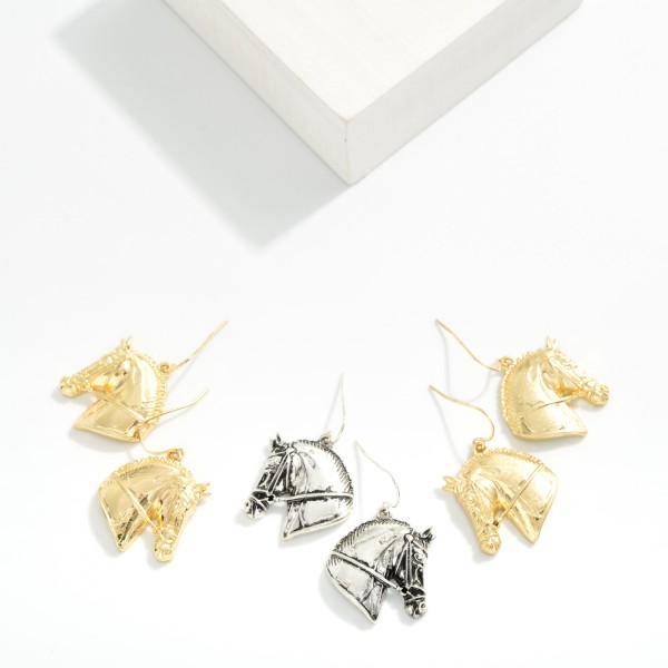 Metal Tone Horse Drop Earrings 

- Approximately 1" L 