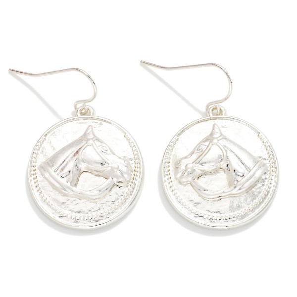 Metal Tone Medallion Drop Earring Featuring Metal Tone Horse Detail 

- Approximately 1.5" L 