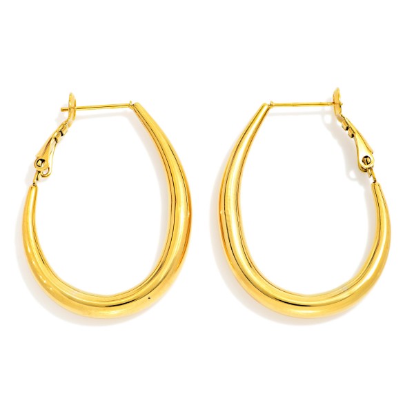 Metal Tone Tapered Teardrop Hoop Earrings 

- Stainless Steel 
- Approximately 1.75" L