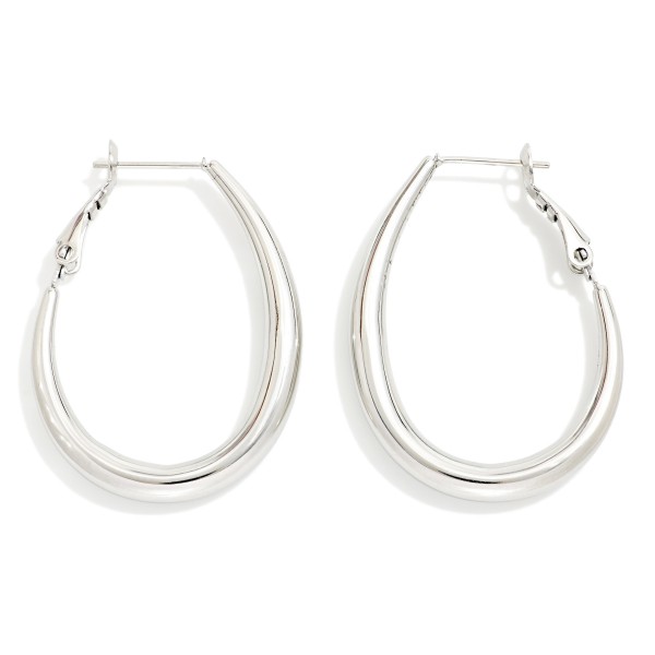 Metal Tone Tapered Teardrop Hoop Earrings 

- Stainless Steel 
- Approximately 1.75" L