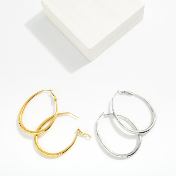 Tapered Oval Hoop Earrings 

- Stainless Steel
- Approximately 2" L