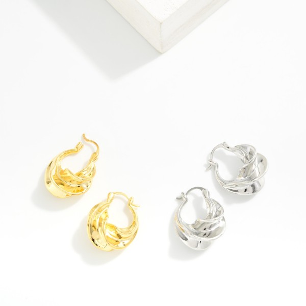 Twisted Metal Hoop Earrings 

- Gold Dipped
- Approximately 1" L
