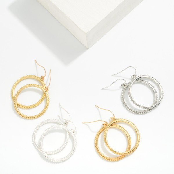Flat Metal Hoop Earring With Studded Border 

- Approximately 1.5" D  