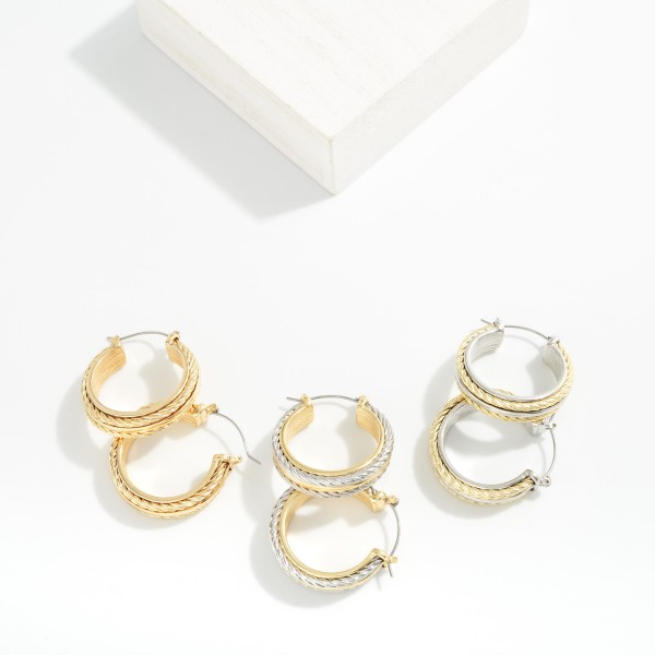 Metal Tone Hoop Earrings With Twisted Metal Details 

- Approximately 1" D