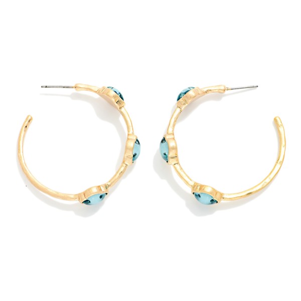 Metal Tone Hoop Earrings Featuring Glitter Acetate Clover Stations 

- Approximately 1.5" L 
