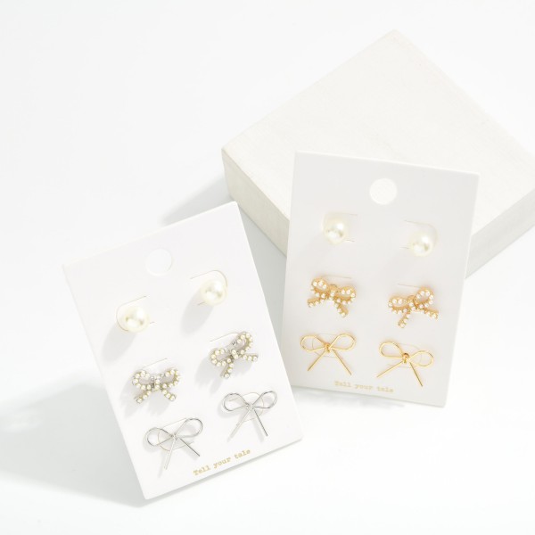 Set Of Three Metal Tone Earrings Featuring Bows & Pearls 

-Approximately .05-.75" L 