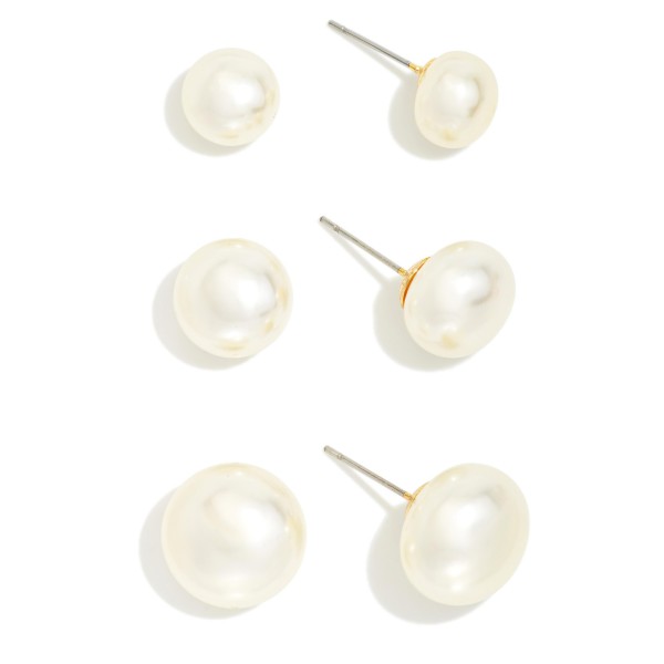 Graduated Pearl Stud Earring Set with three pairs of classic faux pearl studs in small, medium, and large sizes. Lustrous button pearls on simple posts make it easy to mix sizes across multiple piercings or switch looks from day to night. A timeless gift for bridesmaids, graduates, teachers, and moms. Pearl studs never go out of style, and a three pair set at an approachable price makes this a dependable year round seller.