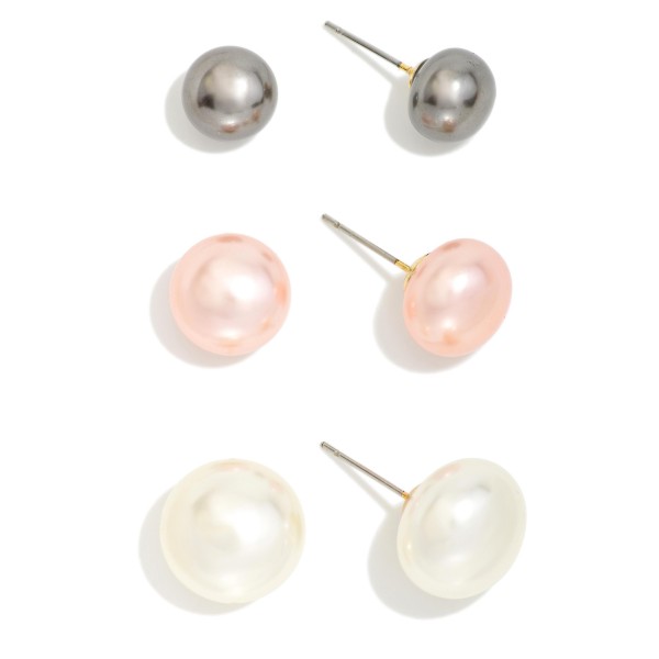 Graduated Pearl Stud Earring Set with three pairs of classic faux pearl studs in small, medium, and large sizes. Lustrous button pearls on simple posts make it easy to mix sizes across multiple piercings or switch looks from day to night. A timeless gift for bridesmaids, graduates, teachers, and moms. Pearl studs never go out of style, and a three pair set at an approachable price makes this a dependable year round seller.