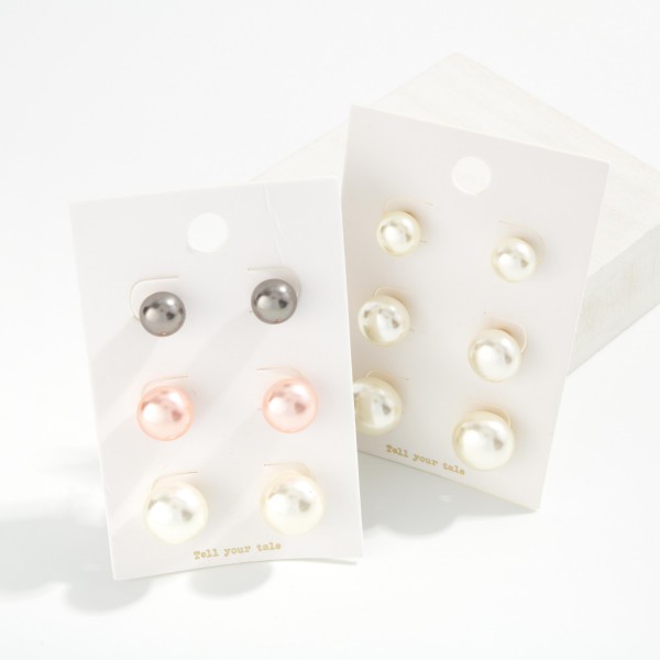 Graduated Pearl Stud Earring Set with three pairs of classic faux pearl studs in small, medium, and large sizes. Lustrous button pearls on simple posts make it easy to mix sizes across multiple piercings or switch looks from day to night. A timeless gift for bridesmaids, graduates, teachers, and moms. Pearl studs never go out of style, and a three pair set at an approachable price makes this a dependable year round seller.