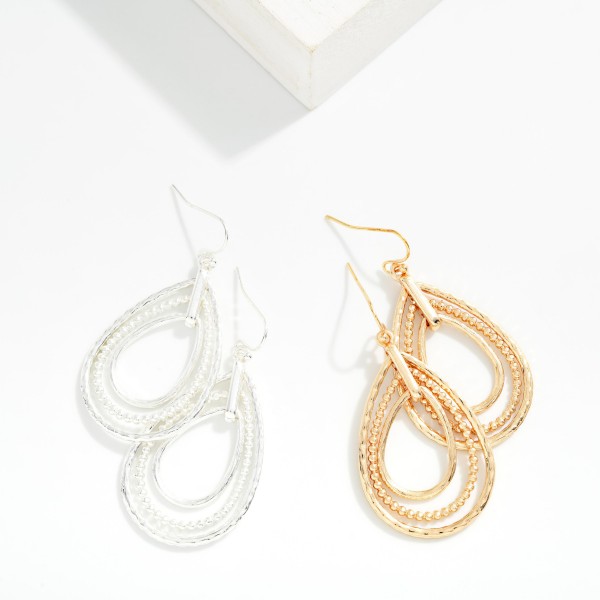 Nesting Metal Tone Teardrop Drop Earrings 

- Approximately 2" L
