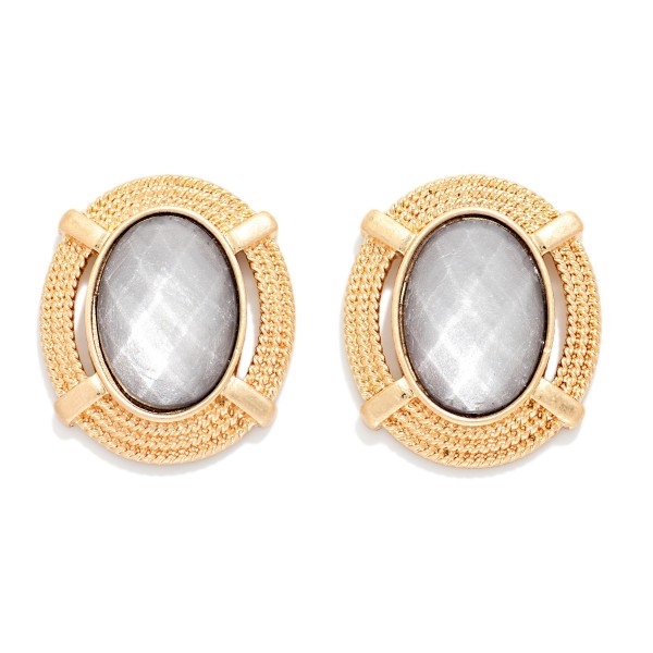 Oval Glass Crystal Stud Earring Featuring Gold Tone Metal Border 

- Approximately 1" L

