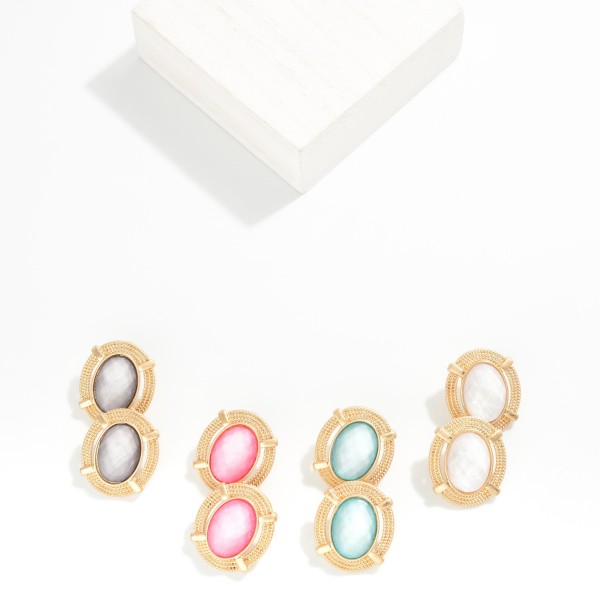 Oval Glass Crystal Stud Earring Featuring Gold Tone Metal Border 

- Approximately 1" L

