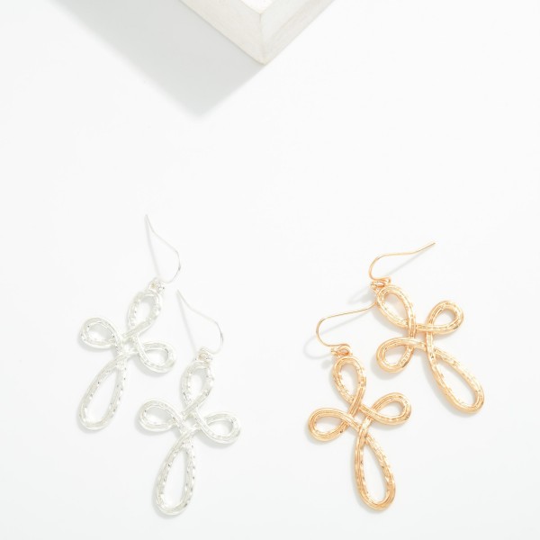 Metal Tone Textured Infinity Cross Drop Earring

- Approximately 2" L 