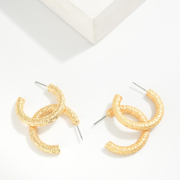Textured Metal Tone Tube Hoop Earrings 

- Approximately .75" D