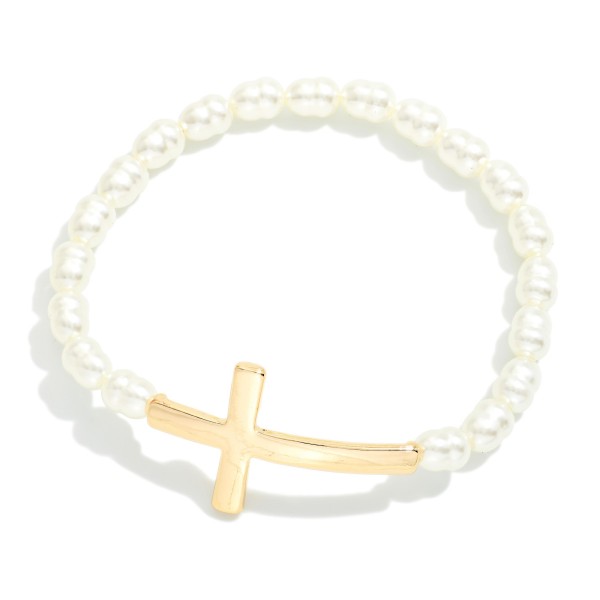 Baroque Beaded Stretch Bracelet Featuring Metal Tone East West Cross

- Approximately 2.5" D