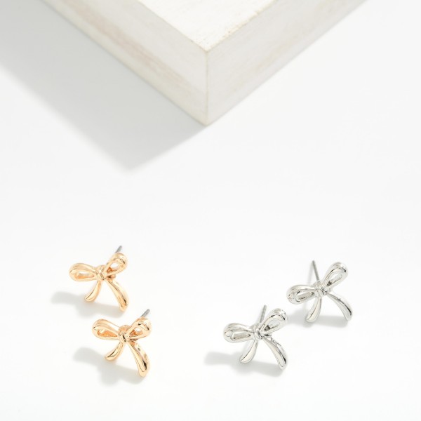 Metal Tone Bow Stud Earrings 

- Approximately .5" L