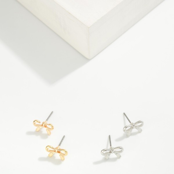 Metal Tone Bow Stud Earrings 

- Approximately .25" L