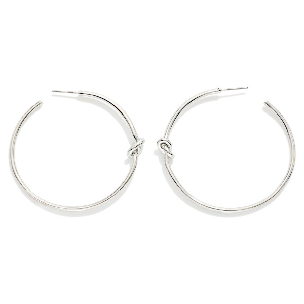 Metal Tone Knotted Hoop Earrings 

- Brass Plated 
- Approximately 2" D