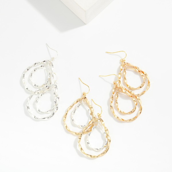 Nesting Twisted Metal Teardrop Earrings 

- Approximately 2" L