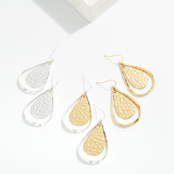 Hollow Flat Metal Teardrop With Hammered Metal Nesting Teardrop Drop Earrings 

- Approximately 2" L