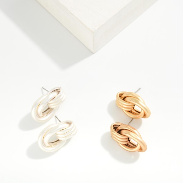 Metal Tone Intertwined Hoops Door Knocker Post Drop Earrings 

- Approximately 1.25" L
