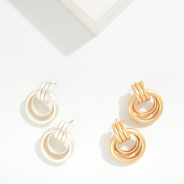 Metal Tone Nesting Hoops Door Knocker Post Drop Earrings 

- Approximately 1.25" L