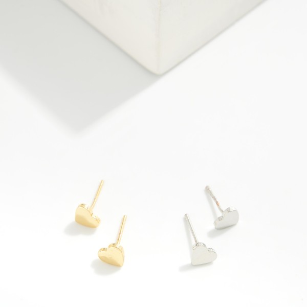 Metal Tone Heart Stud Earrings 

- Gold Dipped 
- Approximately .15" L