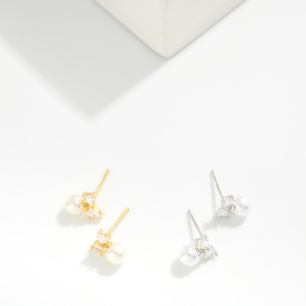 Cubic Zirconia Bow & Pearl Stud Earrings 

- Gold Dipped
- Approximately .25" L
