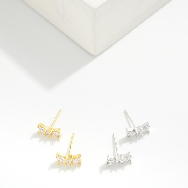 Cubic Zirconia Bow Stud Earrings 

- Gold Dipped
- Approximately .15" L
