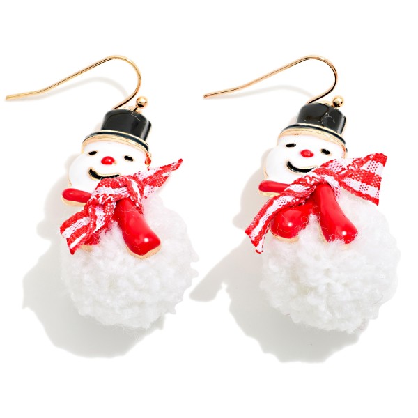 Fuzzy Pom Snowman Drop Earrings featuring a soft, fluffy pom pom body topped with a smiling snowman face, a tiny top hat, and a gingham scarf, hanging from lightweight fishhook wires. The plush texture makes these irresistibly cute and fun to touch. A sweet pick for winter parties, classroom celebrations, and cozy holiday outfits. Soft textured novelty earrings are a top impulse buy, so they work great at the register all season.