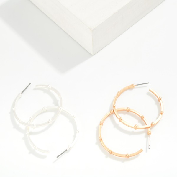 Metal Tone Studded Hoop Earrings 

- Approximately 1.25" D