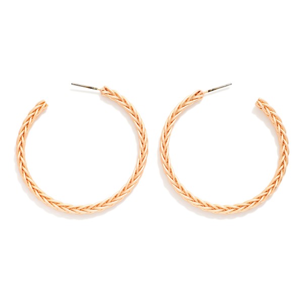 Braided Texture Open Hoop Earrings featuring a slim, open front hoop etched with a woven braid pattern and finished in a soft matte metal tone. The textured surface adds subtle dimension, while the lightweight post design keeps them comfortable all day. An easy everyday hoop that works with casual weekend outfits, workwear, and western looks alike. Versatile, giftable, and priced to move, textured hoops are a staple reorder for boutique jewelry walls.