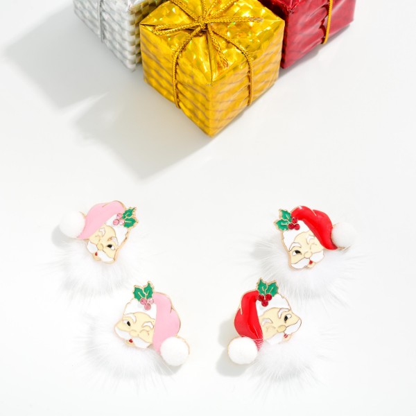 Fuzzy Santa Beard Stud Earrings featuring a jolly enamel Santa face with a holly trimmed hat, a soft pom tip, and a fluffy faux fur beard that adds irresistible texture. The post back design keeps the playful look secure and comfortable for all day wear. A cute, conversation starting pick for Christmas parties, school events, and holiday photos. Fun textures and cheerful characters make these an easy holiday impulse buy at the register.