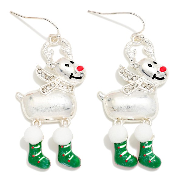 Rhinestone Reindeer Stocking Drop Earrings featuring a cheerful reindeer with sparkling rhinestone antlers and scarf, a shiny button nose, and dangling enamel stocking legs topped with fluffy pom trim. The movable stocking charms swing with every step for a playful, festive look on lightweight fishhook wires. A crowd pleaser for Christmas parties, school events, and holiday photos. Whimsical character earrings like these are top holiday impulse buys.